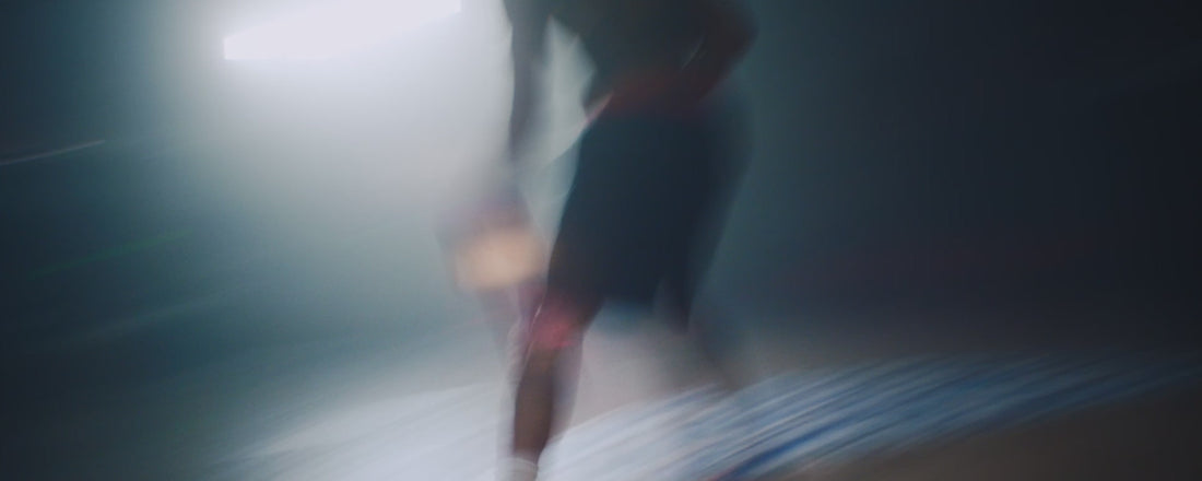 A video in a darkly lit gymnasium, showing various cuts of Aaron Gordon playing basketball wearing nothing but SAXX Multi-Sport Mesh Boxer Briefs.