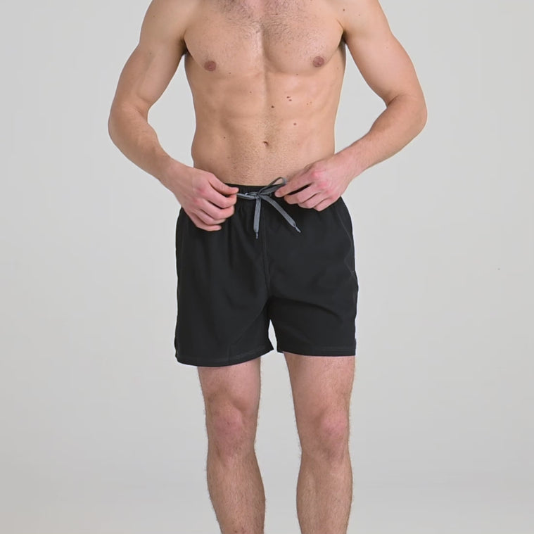 Model wearing Oh Buoy 2N1 Swim Short 5"