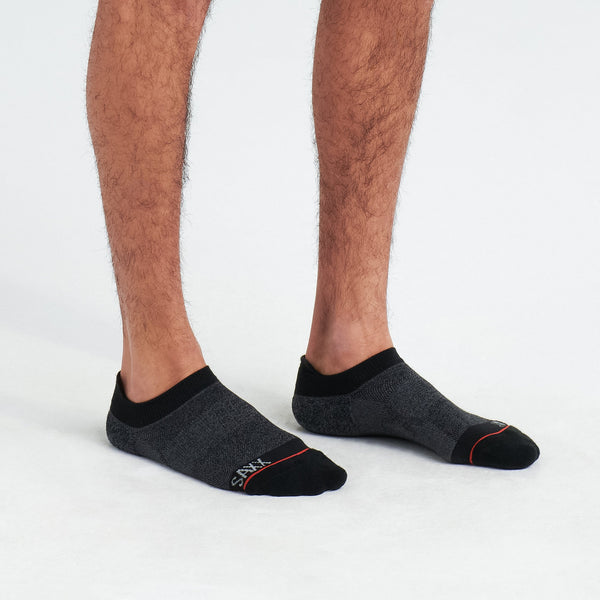 Side - Model wearing Whole Package Low Show Sock in Black Heather