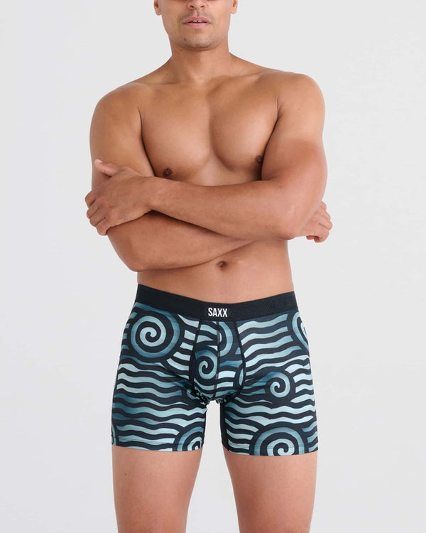 Front - Model wearing Droptemp Cooling Mesh Boxer Brief Fly in Rip Tide Stripe- Navy Blue