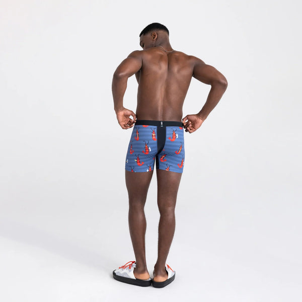 Back - Model wearing Droptemp Cooling Mesh Boxer Brief Fly in Shrimp Cocktail- Navy