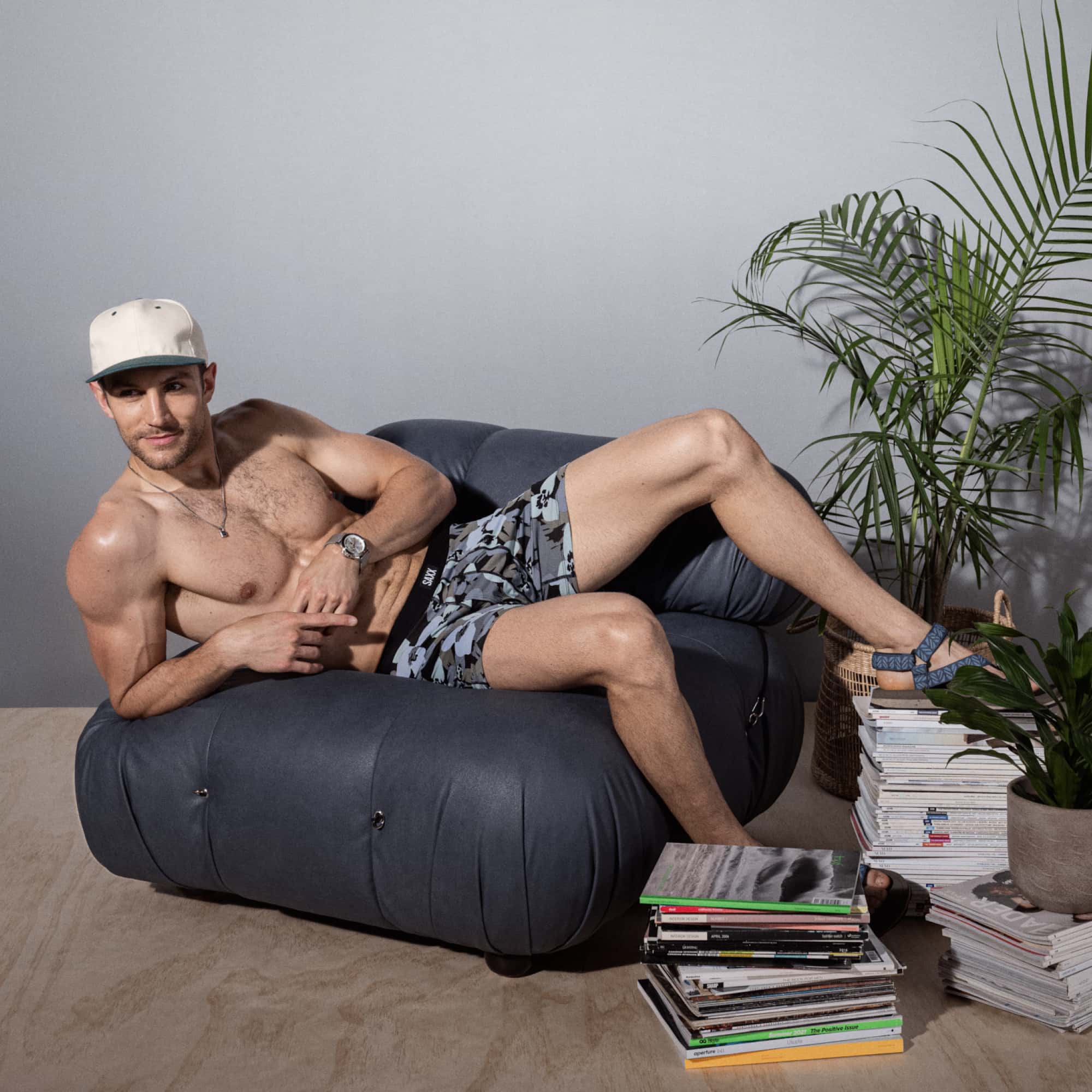 Model posing in Daytripper Boxer Brief in Camo Flowers- Blue Fog