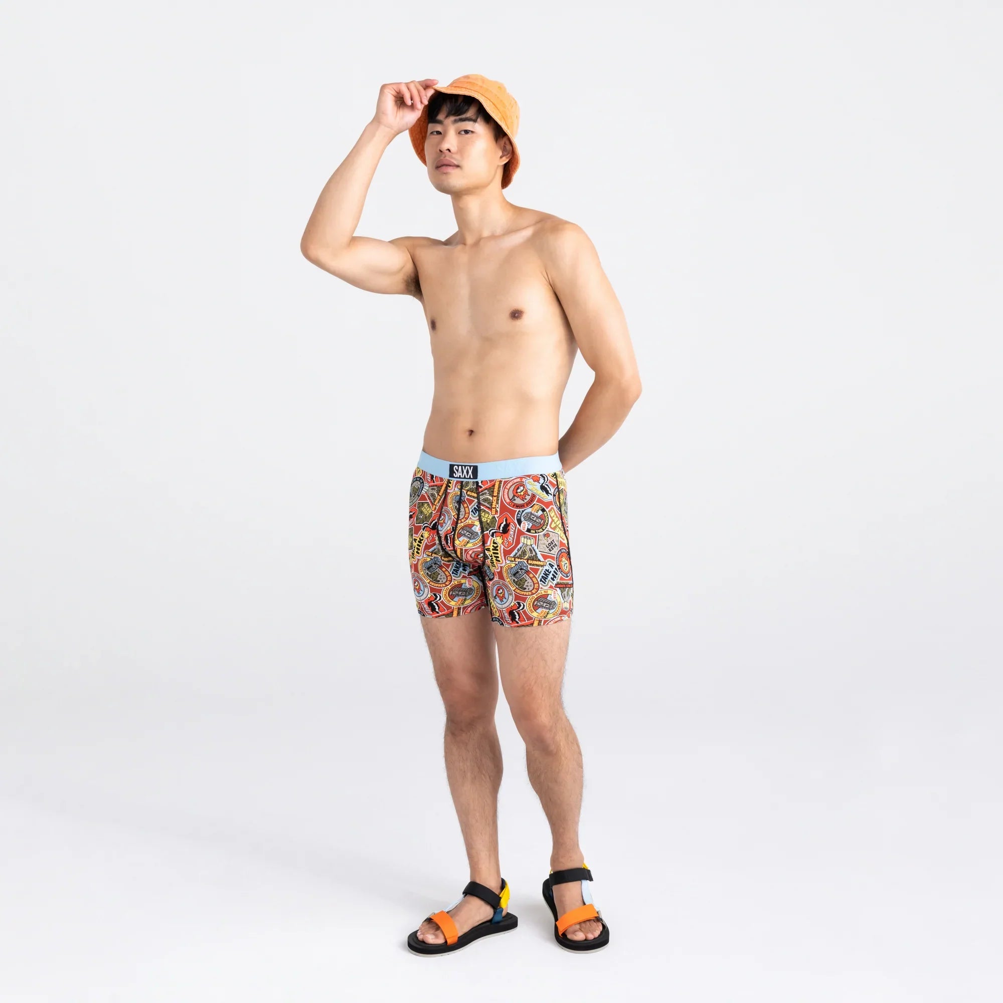 Front - Model wearing Ultra Super Soft Boxer Brief Fly in Demerit Badges- Multi