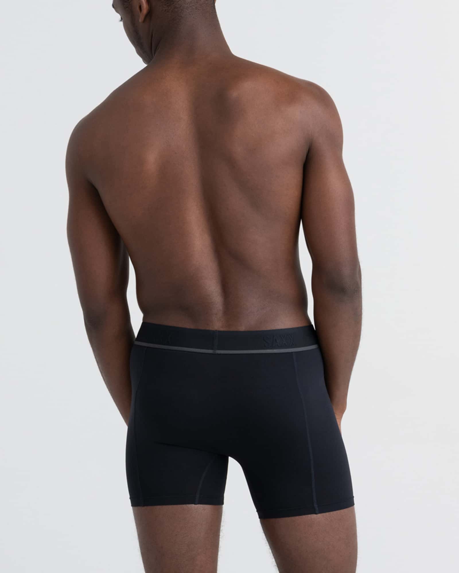 Back - Model wearing Kinetic Light-Compression Mesh Boxer Brief in Blackout