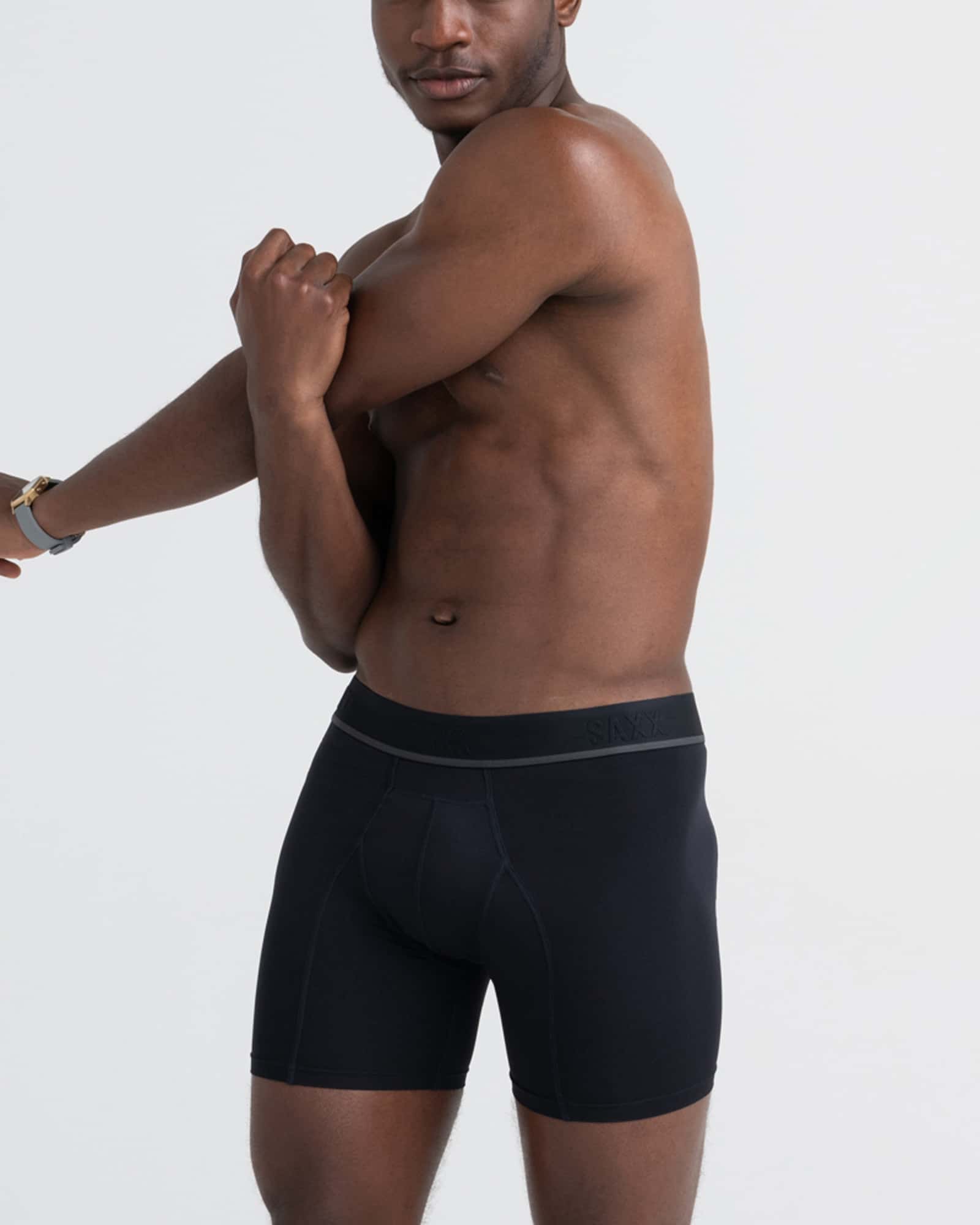 Front - Model wearing Kinetic Light-Compression Mesh Boxer Brief in Blackout