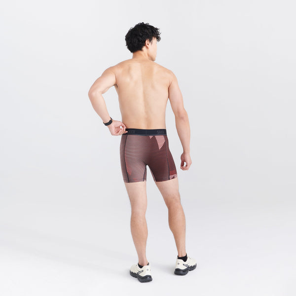 Back - Model wearing Kinetic Light-Compression Mesh Boxer Brief in Optic Mountain- Dark Brick