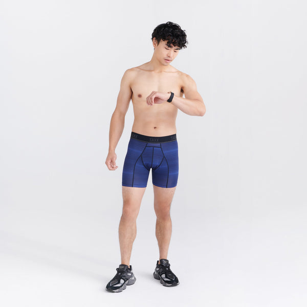 Front - Model wearing Kinetic Light-Compression Mesh Boxer Brief in Variegated Stripe- Blue