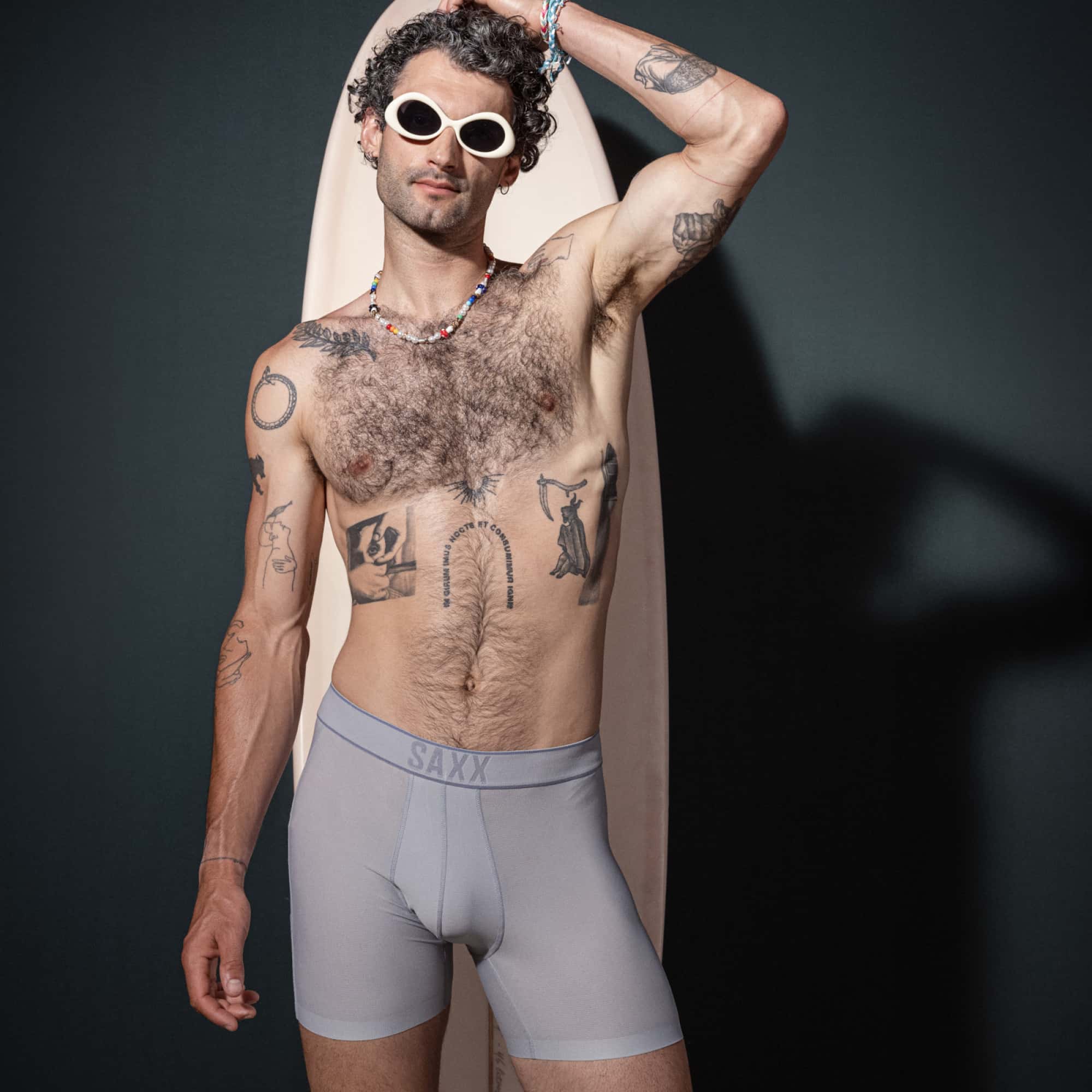 Model posing in DropTemp Cooling Hydro Boxer Brief in Liner Grey