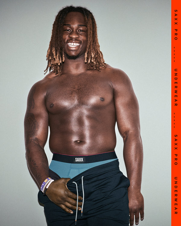 SAXX Gamechanger and College Football Player Ashton Jeanty wearing Multi-Sport Mesh Boxer Brief in Hydro Blue
