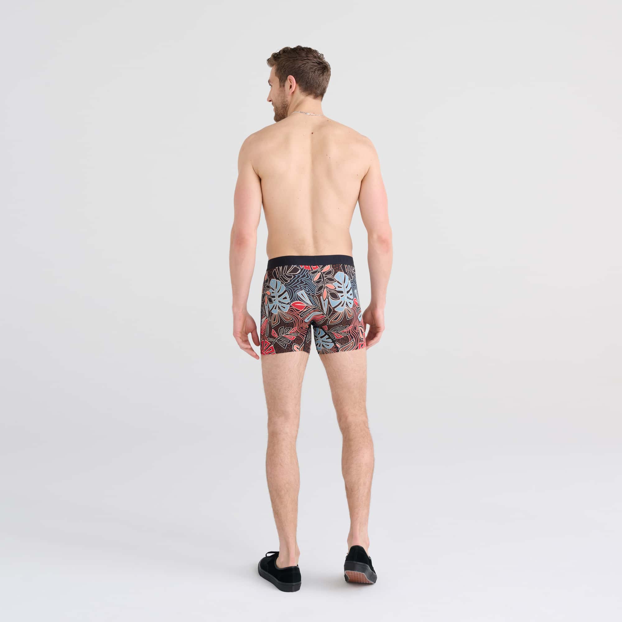 Back - Model wearing Vibe Boxer Brief in Desert Palms- Red Multi