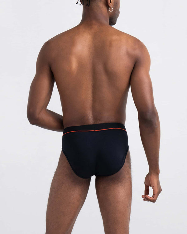 Back - Model wearing Non-Stop Stretch Cotton Brief Fly 3Pk in Black/Deep Navy/White