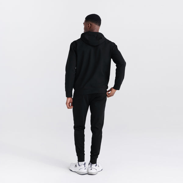 Back - Model wearing Trailzer Full Zip Hoodie in Black