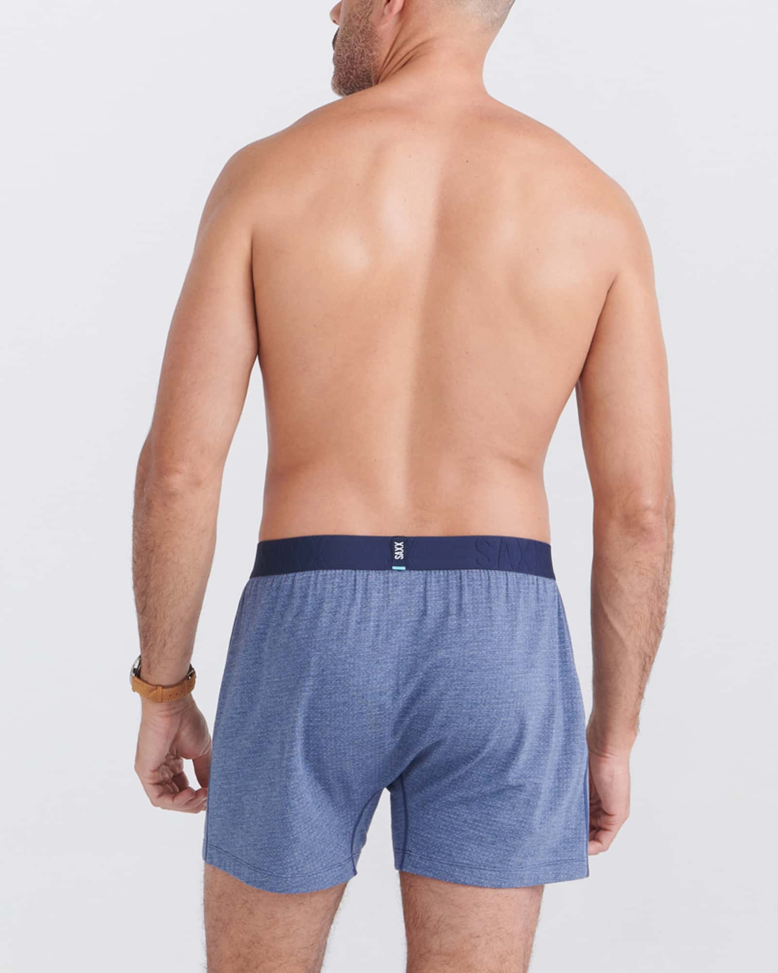 Back - Model wearing Droptemp Cooling Sleep Boxer Fly in Dark Denim Heather