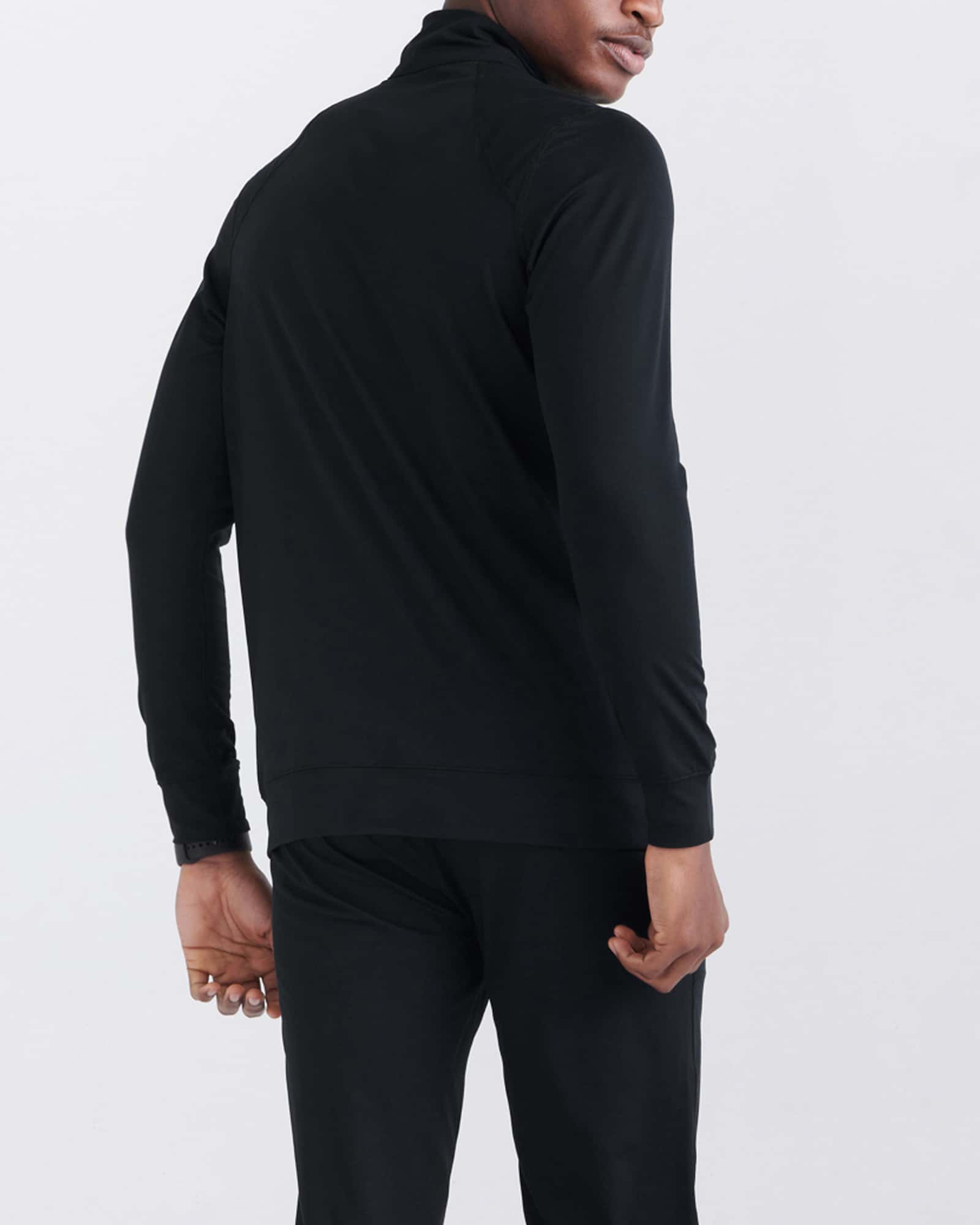 Back - Model wearing Peakdaze Half Zip in Black