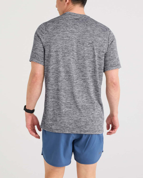 Back - Model wearing Multi-Sport Tech Tee in Faded Black Heather