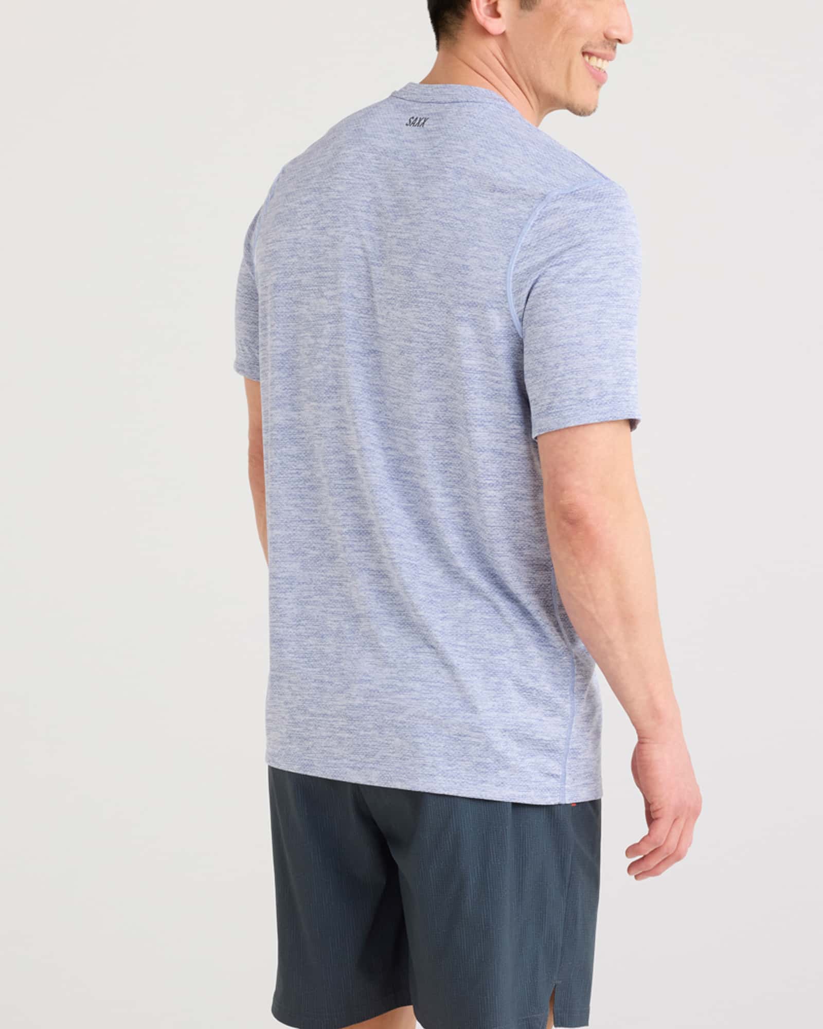 Back - Model wearing Multi-Sport Tech Tee in Tidal Blue Heather