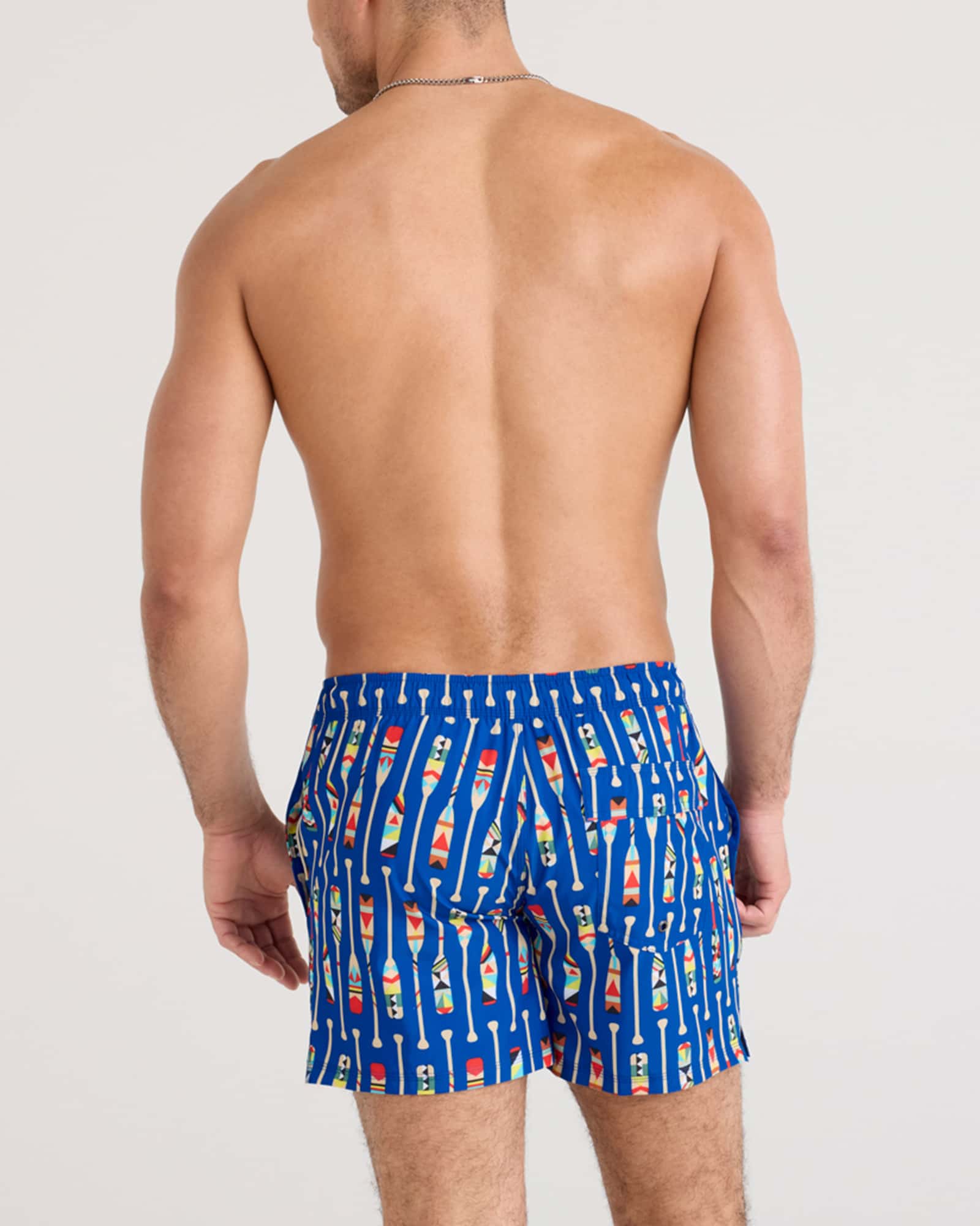 Back - Model wearing Oh Buoy 2N1 Swim Volley 5" in Oartiz-Blue