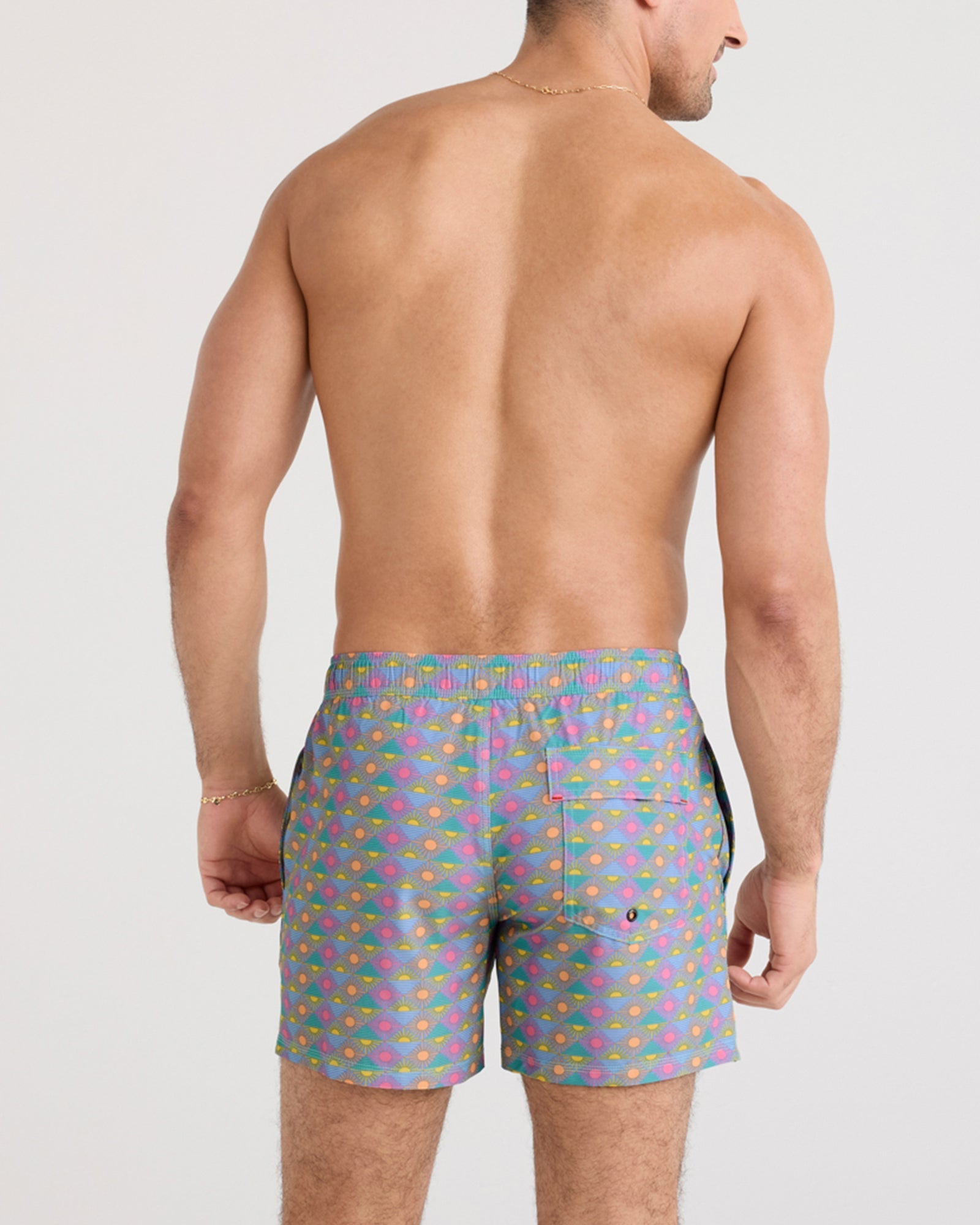 Back - Model wearing Oh Buoy 2N1 Swim Short in Rise And Shine-Tidal Blue