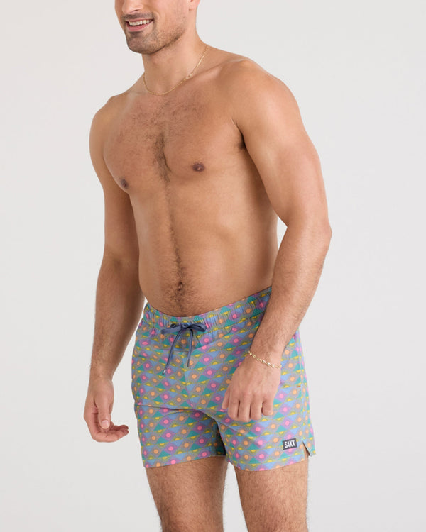 Front - Model wearing Oh Buoy 2N1 Swim Short in Rise And Shine-Tidal Blue