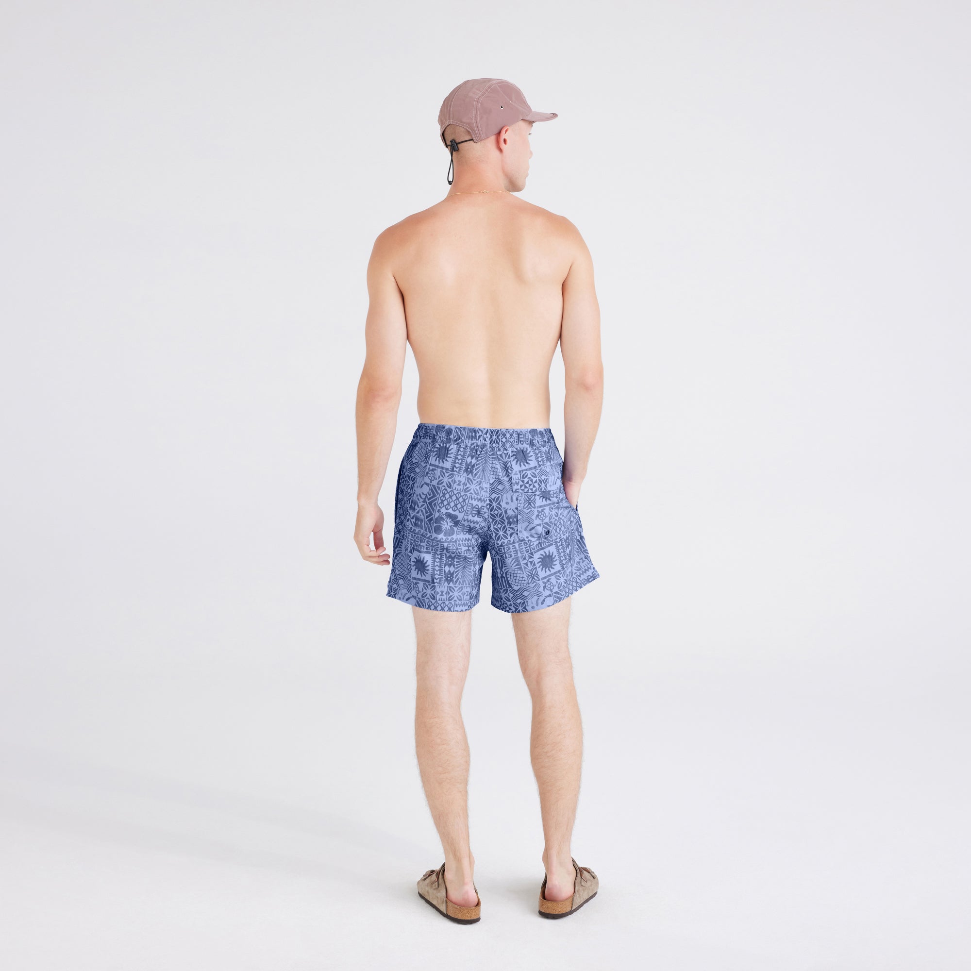 Back - Model wearing  Oh Buoy 2N1 Swim Short Trunk in Tropical Tapa-Lavender