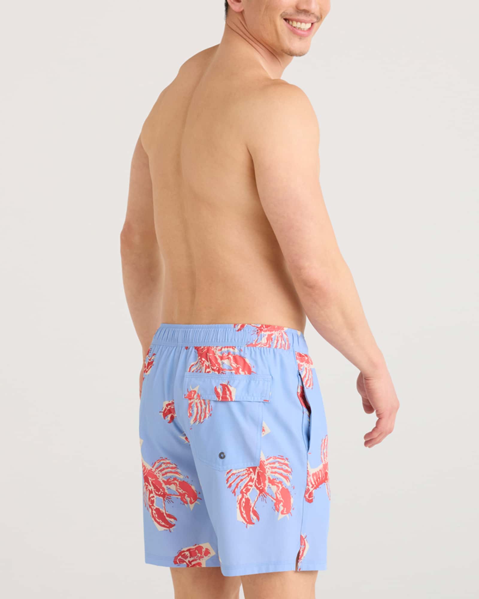 Back - Model wearing Oh Buoy 2N1 Swim Volley 7" in Lobster Boil-Bel Air Blue