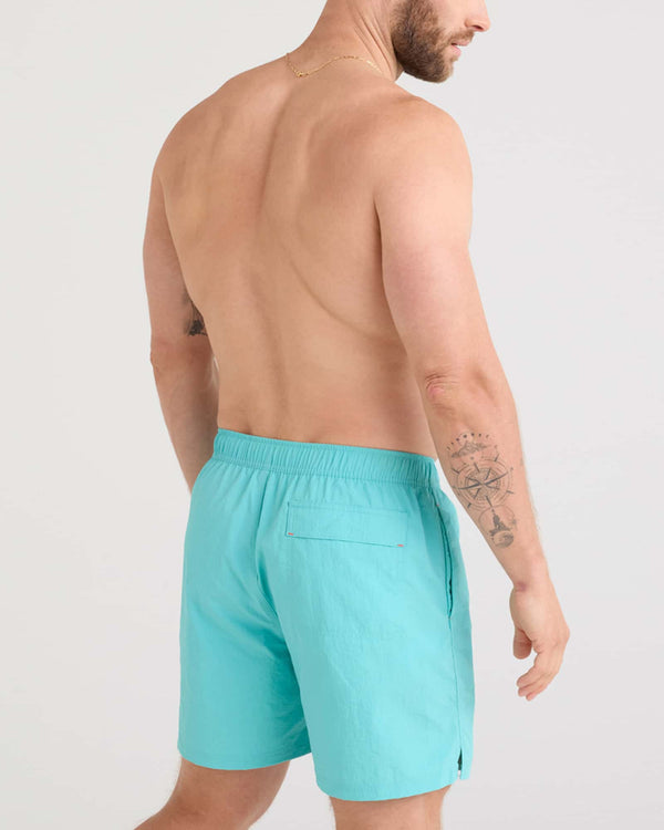 Back - Model wearing Go Coastal 2N1 Volley 5" in Turquoise