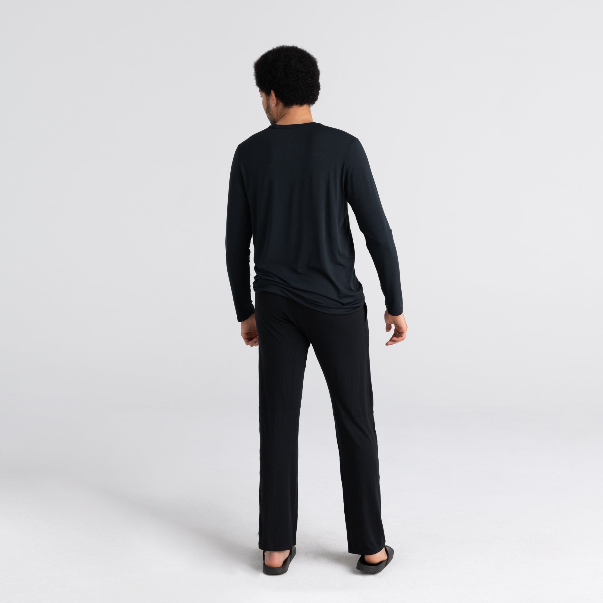 Back - Model wearing Sleepwalker Long Sleeve Pocket Tee in Black